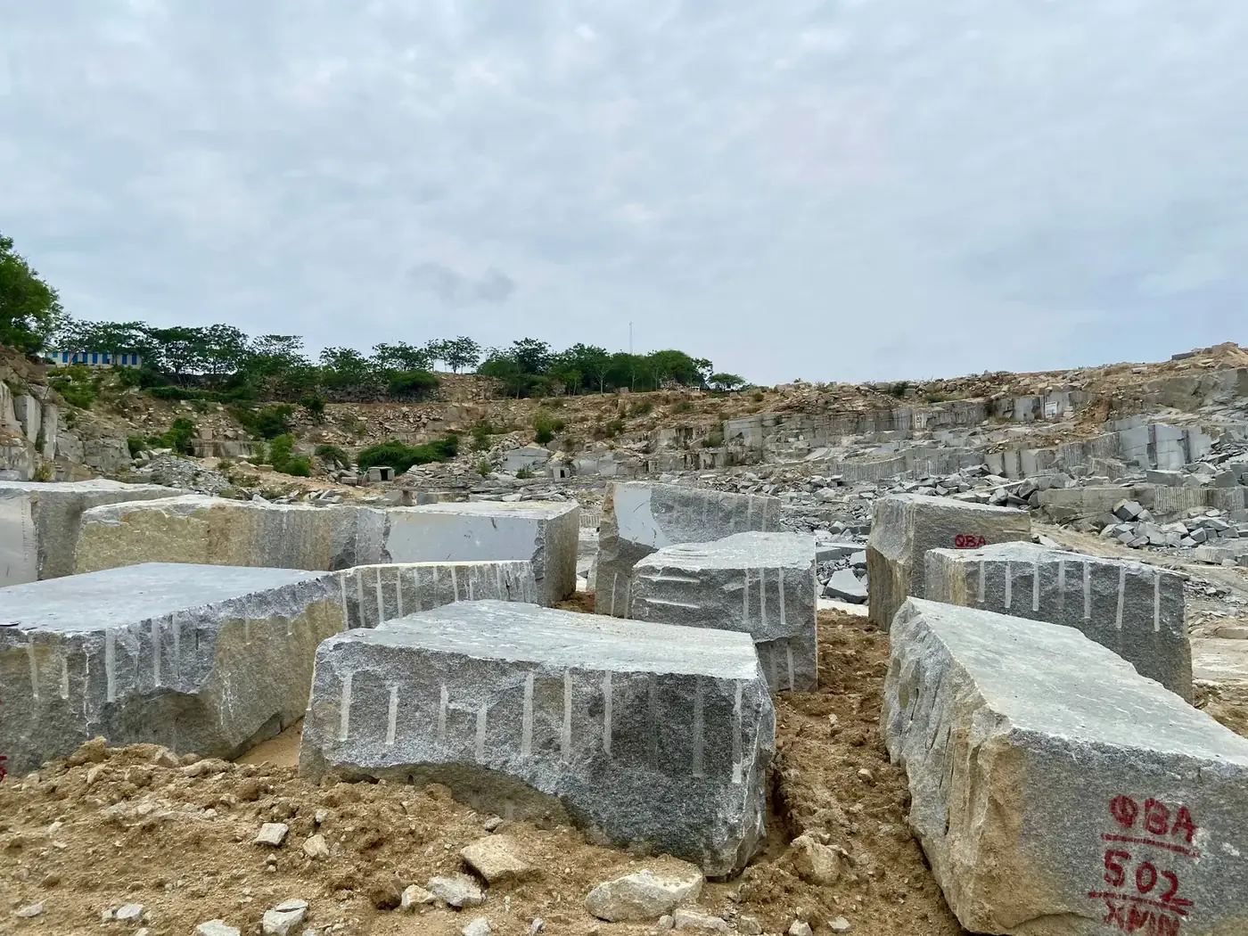 Granite blocks marked and staged at the quarry for inspection