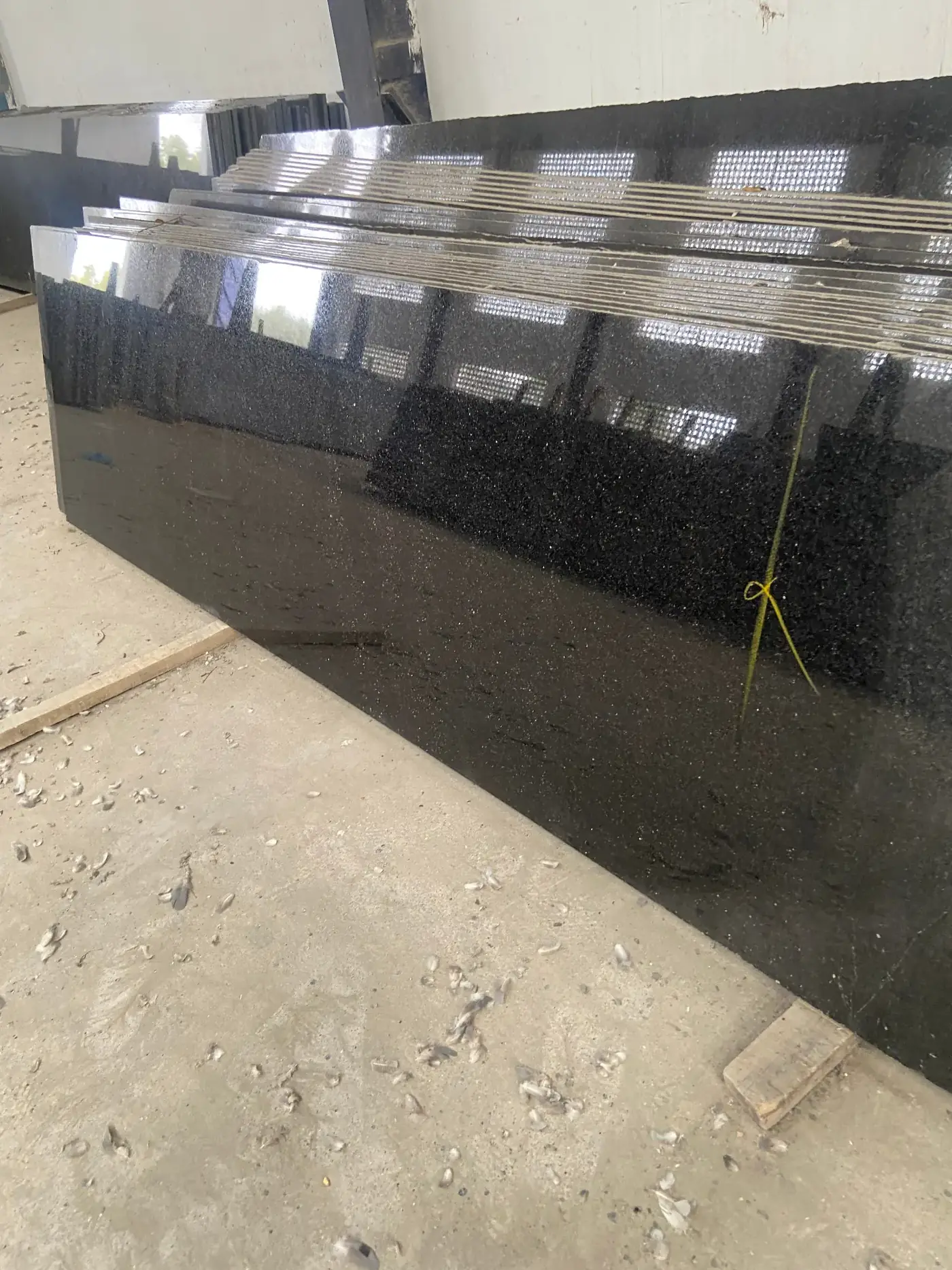 Mirror-polished Black Galaxy granite slabs at the factory