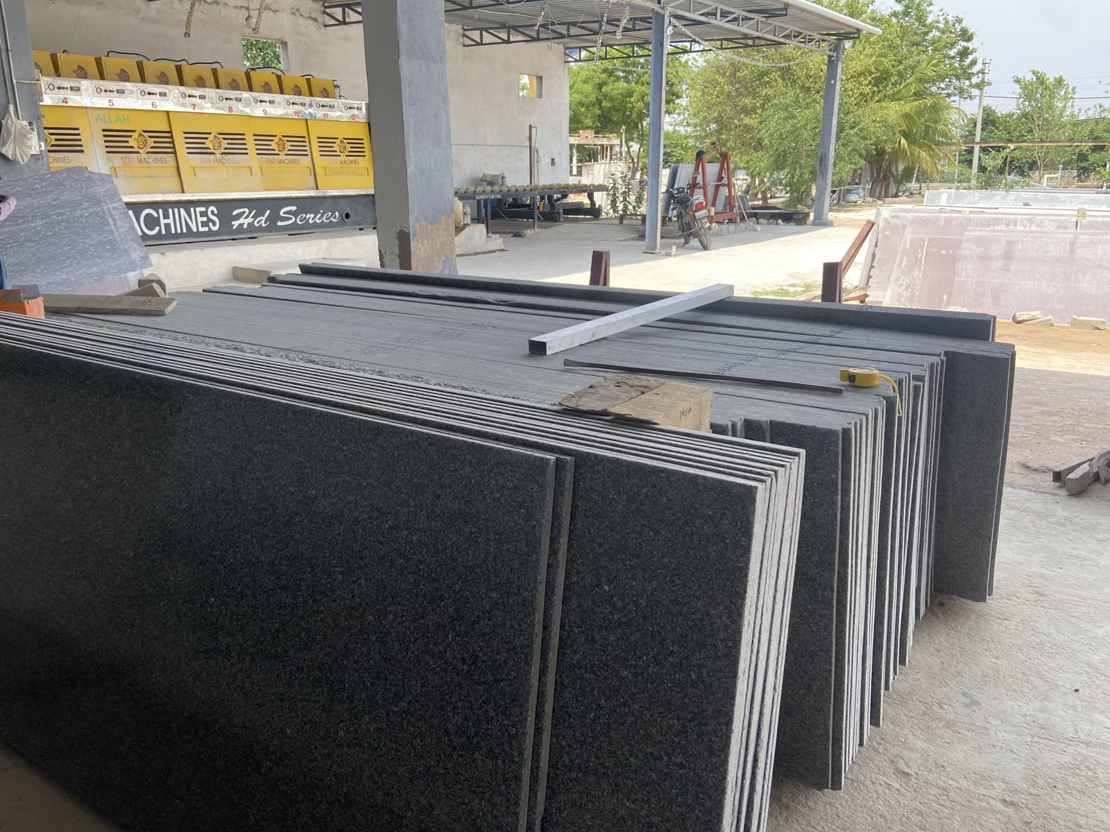Polished granite slabs stacked at the Satvaexport factory